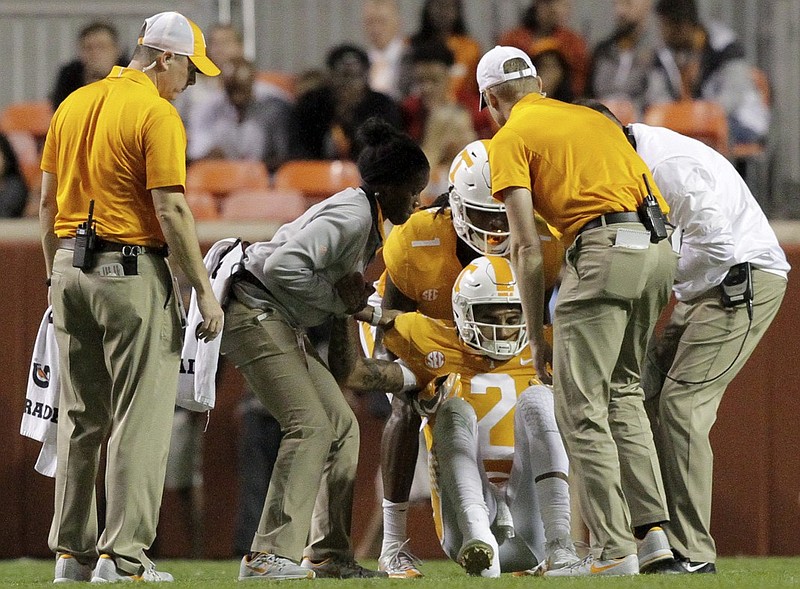 Tennessee wide receiver Marquez Callaway and trainers help quarterback Jarrett Guarantano up after he was injured during last November's home game against Southern Miss. Injuries were a problem for the Vols under former coach Butch Jones, and new coach Jeremy Pruitt is emphasizing being mindful of teammates' health during practices.