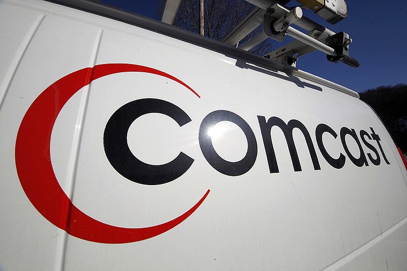 This Feb. 11, 2011, file photo, shows the Comcast logo on one of the company's vehicles in Pittsburgh. (AP Photo/Gene J. Puskar, File)
