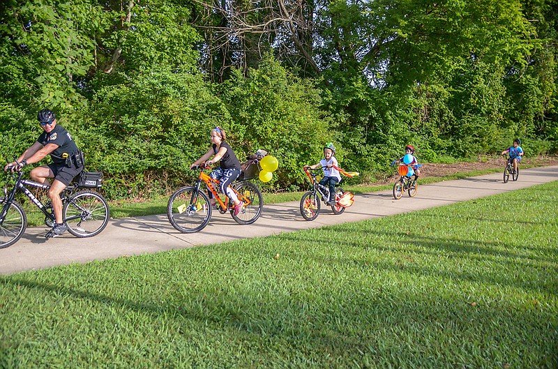 Collegedale Police Cpl. Seymour leads the pack during the city's recent bike parade.