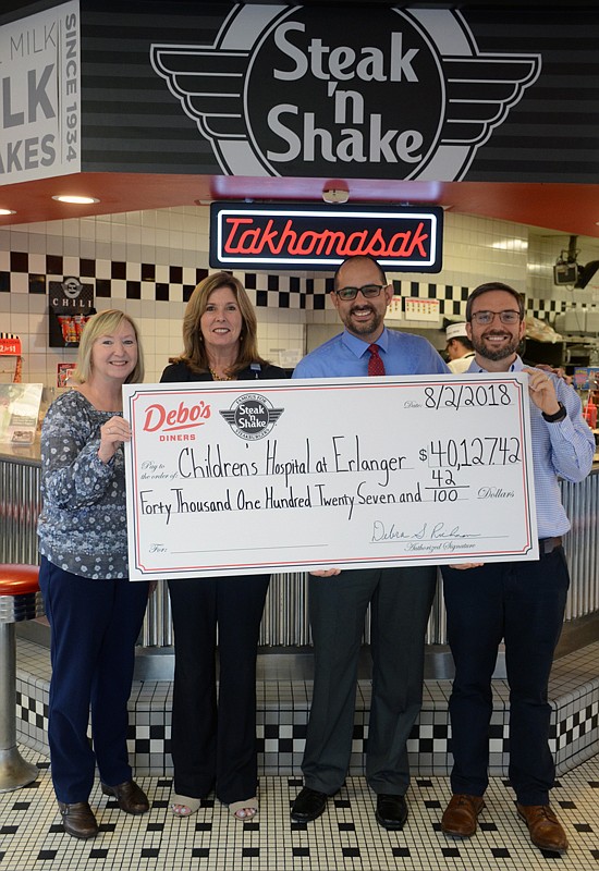 Form left, Debbie Richman, head of the local Steak 'n Shake franchise, presents check for Erlanger Children's Hospital along with Julie Taylor, Steven Wagner and Mike Richman.


