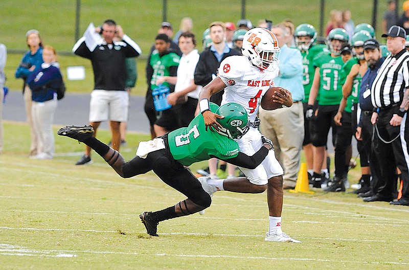 East Ridge's Alonzo Russell  gets tackled by East Hamilton's Ryan Patton during the game on Sept. 1, 2017. (Photo by Mark Gilliland) 