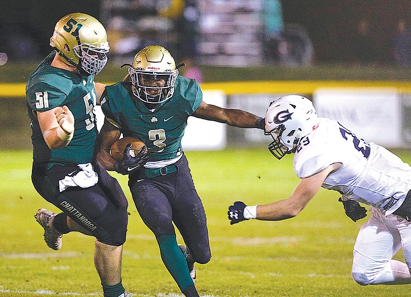 Notre Dame's Jacob Brigman (51) blocks as teammate Cameron Wynn (3) stiff-arms Knox Grace defender Blake Rankin (29) during the Irish's second-round playoff football game against Knoxville Grace Christian Academy at Notre Dame High School on Friday, Nov. 10, 2017, in Chattanooga, Tenn.