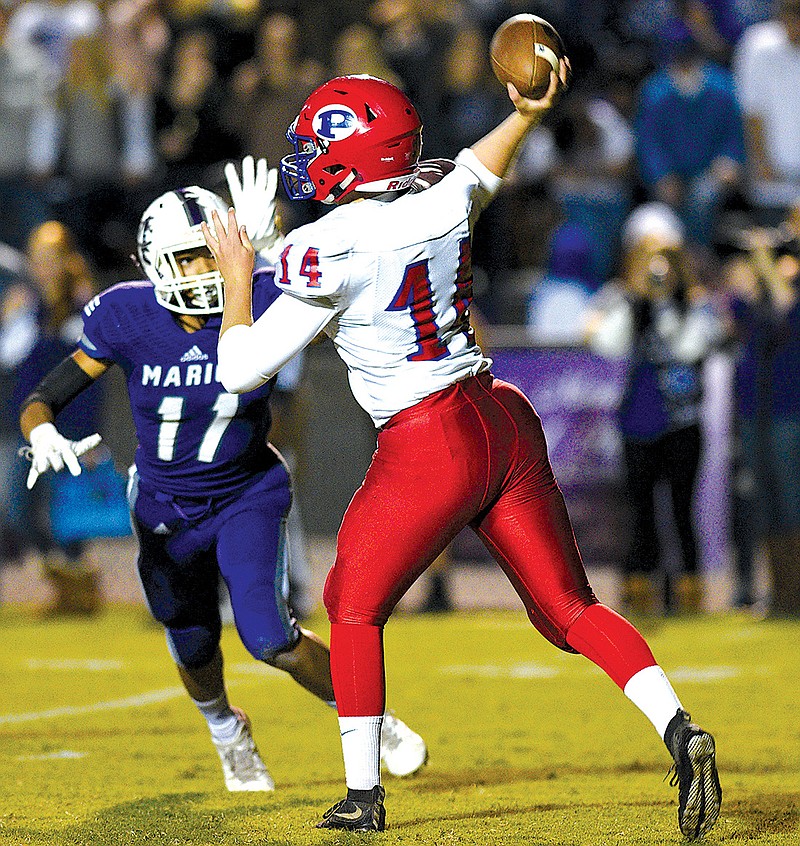 Polk quarterback Nate Waters (14) passes. The Polk County Wildcats visited the Marion County Warriors in TSSAA football action on Oct. 27, 2017. 