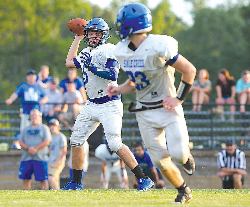 Sale Creek quarterback Tanner Harvey (5) throws a pass to Nathan Hutchings (23) in a scrimmage game between Silverdale and Sale Creek on Friday, Aug. 4, 2017, at Silverdale Baptist Academy in Chattanooga, Tenn. 