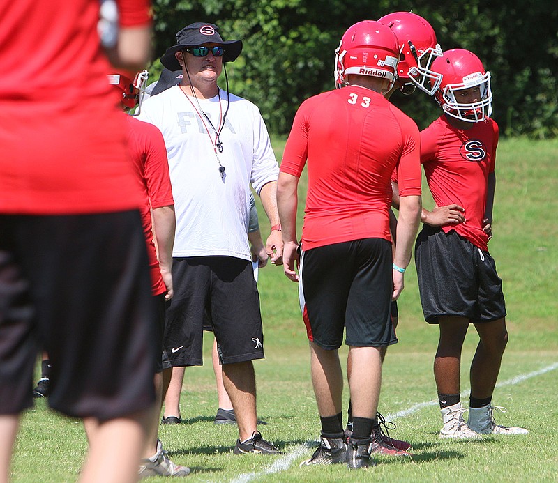 Sonoraville head coach Denver Pate speaks with players on his team during 7-on-7s Thursday, July 13, 2017, in Calhoun, Ga.