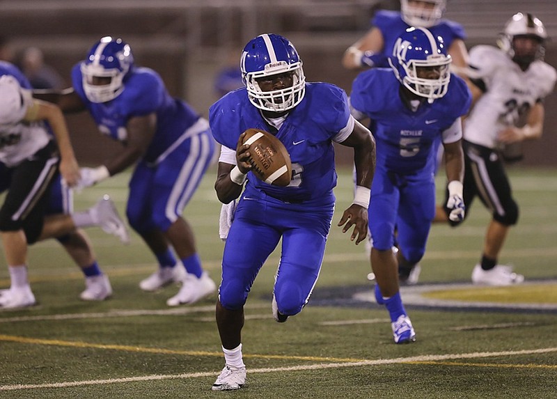 Staff photo by Erin O. Smith / 
McCallie quarterback DeAngelo Hardy (10) runs with the ball during the McCallie vs. Bradley Central game in the Best of Preps football jamboree Friday, August 10, 2018 at Finley Stadium in Chattanooga, Tennessee. 