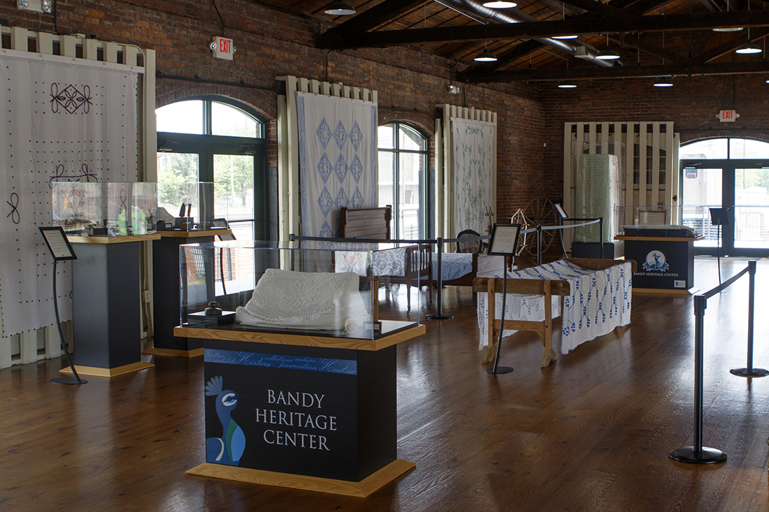 Staff photo by C.B. Schmelter /
The Bandy Heritage Center for Northwest Georgia's Sandra Mahs exhibit is seen at the Dalton Freight Depot on Wednesday, Aug. 15, 2018 in Dalton, Ga. The display represents one woman's search to find as many hand-tufted (and some machine-tufted) chenille bedspreads as she could find. Tufting was a cottage industry in the early 1900s that eventually led to Dalton's dominance in carpets and textiles. Sandra Mahs lives in Illinois, but some of her people were involved in the early days of tufting. Over about 20 years, she made it her mission to find as many spreads as she could to show the ingenuity and craftsmanship of Northwest Georgia residents. She recently donated most of her collection to the Bandy Center.