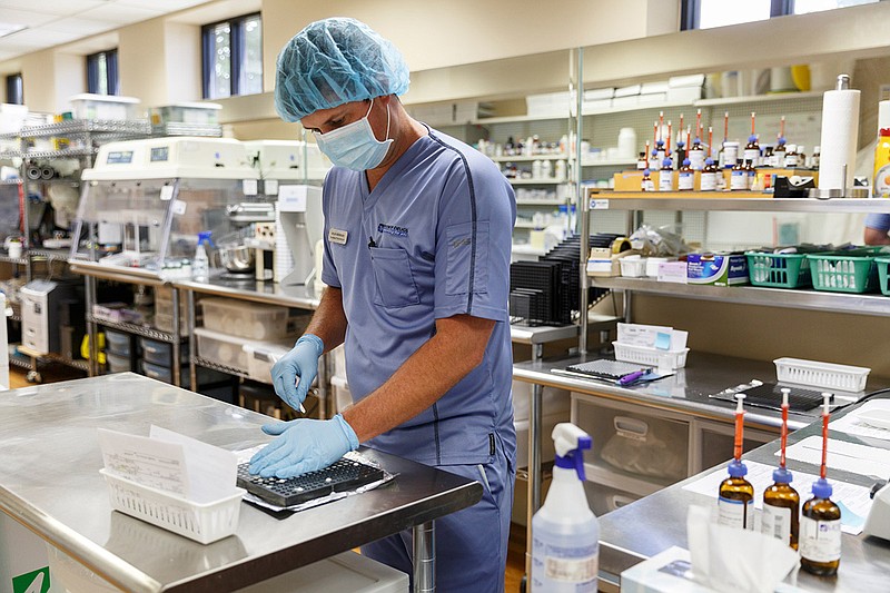 Pharmacy technician Ryan Sherman makes troches, which are dissolvable hormone tabs, at Designer Drugs on Wednesday, Aug. 8, 2018, in Chattanoga, Tenn. The locally-owned compounding pharmacy specializes in eye drops with sales across all 50 states.