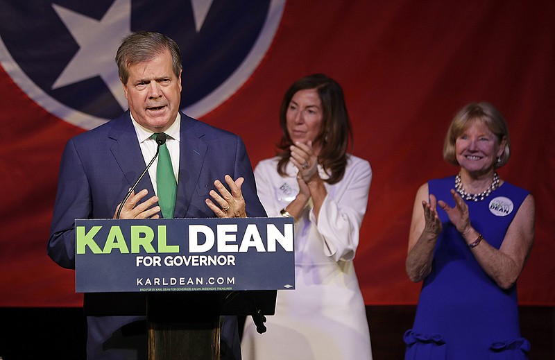 Karl Dean thanks supporters at a victory party after winning the Democratic nomination for Tennessee governor, Thursday, Aug. 2, 2018, in Nashville, Tenn. With Dean are his wife, Anne Davis, right, and Leslie Dashiell, center, mother-in-law of Dean's son, Rascoe. (AP Photo/Mark Humphrey)