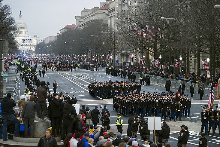FILE - In this Jan. 20, 2017, file photo, military units participate in the inaugural parade from the Capitol to the White House in Washington, Friday, Jan. 20, 2017. 