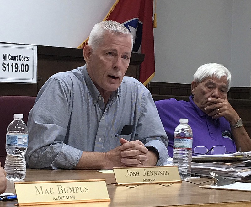 Alderman Paul West, left, details what he said were issues at the Jasper fire department as Mayor Paul Evans looks on during the board's August meeting.