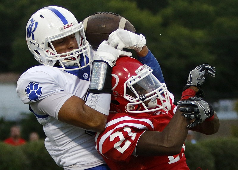 
Dalton's Malachi Gregory (21) breaks up a pass intended for Ringgold's Andre Tarver (3) during a GHSA football game at Harmon Field on Friday, Aug. 17, 2018 in Dalton, Ga. / Staff photo by C.B. Schmelter 