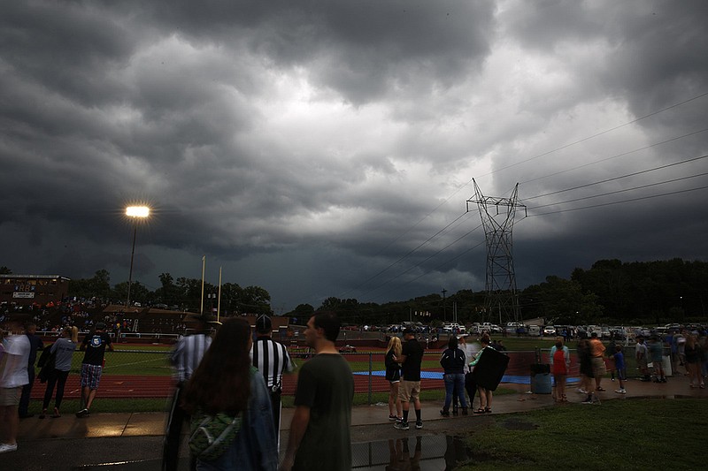  Staff photo by Doug Strickland / 
Storm clouds loom as lightning causes a weather delay before Red Bank's prep football game against Soddy-Daisy at Red Bank High School on Friday, Aug. 17, 2018, in Red Bank, Tenn.