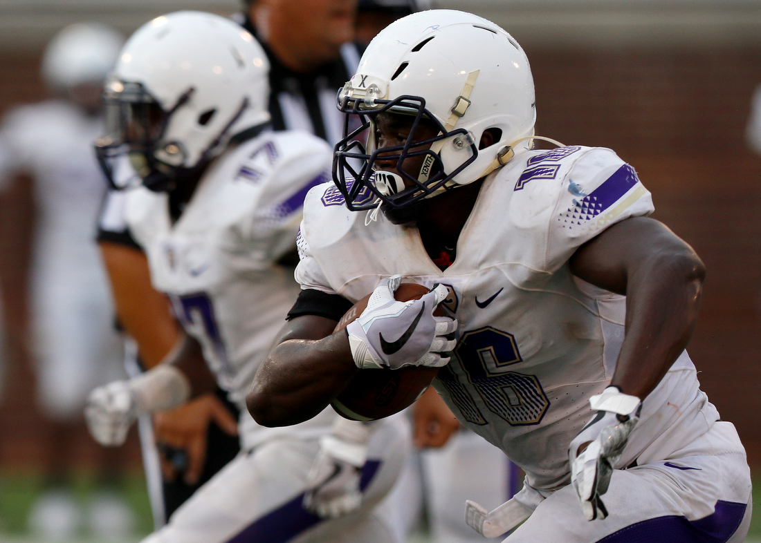 Staff photo by C.B. Schmelter /
Central's Michael McGhee (16) rushes for a touchdown against Walker Valley during the first game of the Chattanooga Kickoff Classic at Finley Stadium on Thursday, Aug. 16, 2018 in Chattanooga, Tenn.