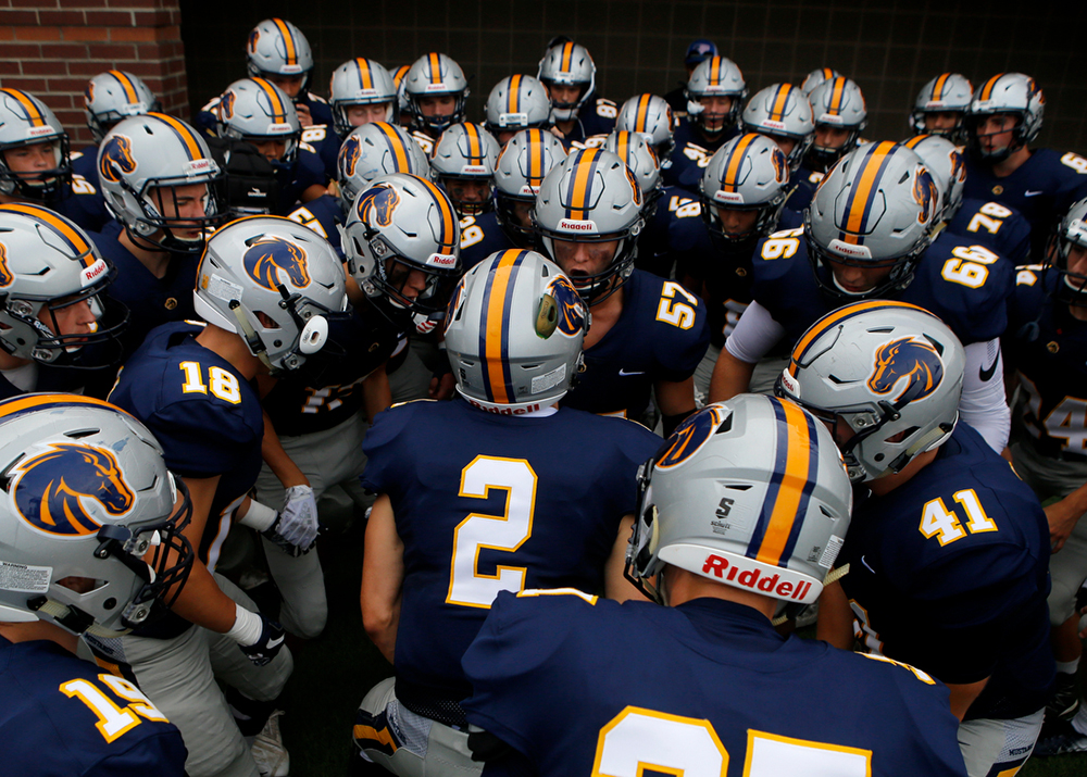 Staff photo by C.B. Schmelter /
Walker Valley gets pumped up around Griffin Broome (2) before taking on Central during the first game of the Chattanooga Kickoff Classic at Finley Stadium on Thursday, Aug. 16, 2018 in Chattanooga, Tenn.