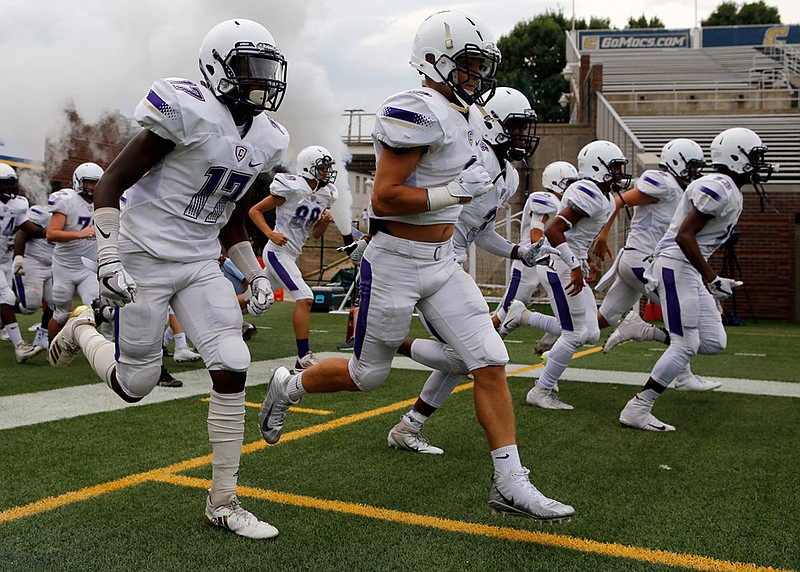 Staff photo by C.B. Schmelter / 
Central takes the field before taking on Walker Valley during the first game of the Chattanooga Kickoff Classic at Finley Stadium on Thursday, Aug. 16, 2018 in Chattanooga, Tenn.