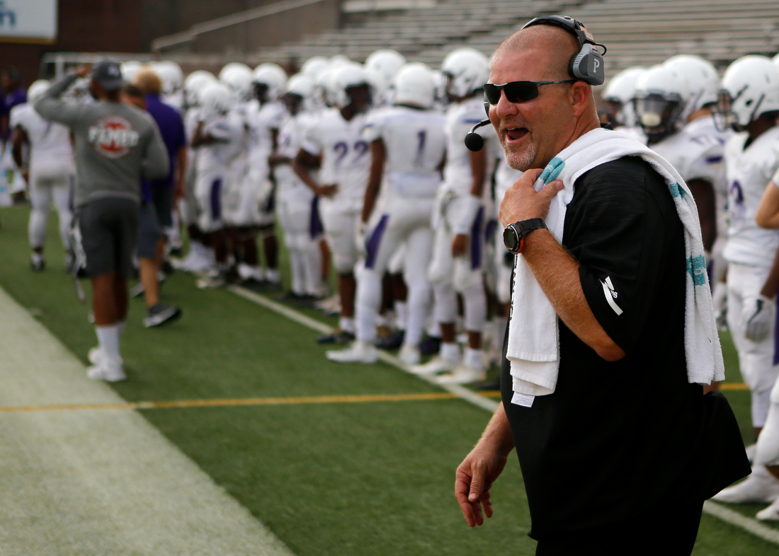 Staff photo by C.B. Schmelter /
Central coach Curt Jones laughs before their game against Walker Valley restarts after a rain delay during the first game of the Chattanooga Kickoff Classic at Finley Stadium on Thursday, Aug. 16, 2018 in Chattanooga, Tenn.