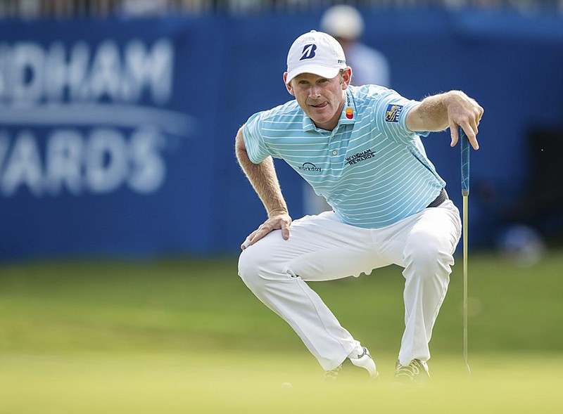 Brandt Snedeker lines up his putt on the 15th hole during the second round of the PGA Tour's Wyndham Championship on Friday at Sedgefield Country Club in Greensboro, N.C. Snedeker followed his opening 11-under 59 with a 67 and held a two-stroke lead after 36 holes.