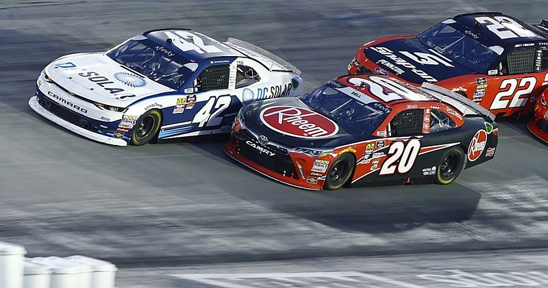 Kyle Larson (42) leads Christopher Bell (20) and Joey Logano (22) on a restart during a NASCAR Xfinity Series race on Friday at Bristol Motor Speedway. Larson won to earn his first victory at Bristol, the Tennessee track he said is his favorite on the circuit.