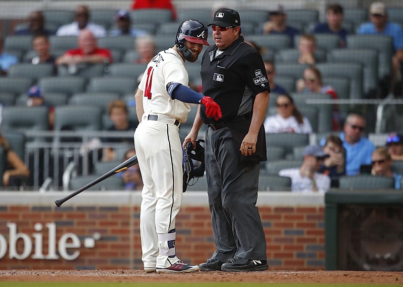 The Atlanta Braves' Ender Inciarte argues a called third strike to end the sixth inning of Sunday's game against the Colorado Rockies in Atlanta. The Rockies won 4-2 to complete a four-game series sweep.