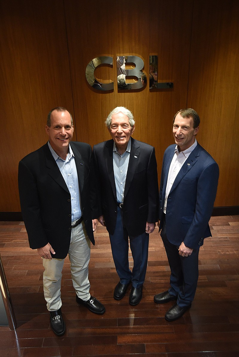 Michael, Charles and Stephen Lebovitz stand in the corporate lobby of CBL Properties. CBL has been in business for four decades, 25 of those as a publicly traded company.