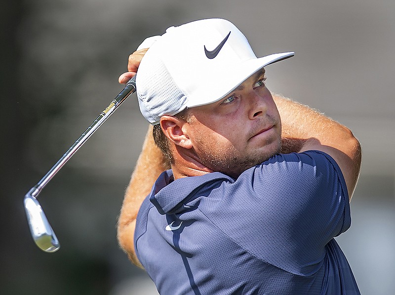 Keith Mitchell follows his tee shot on the 8th hole during the second round of the Wyndham Championship golf tournament in Greensboro, N.C., Friday, Aug. 17, 2018. (H. Scott Hoffmann/News & Record via AP)