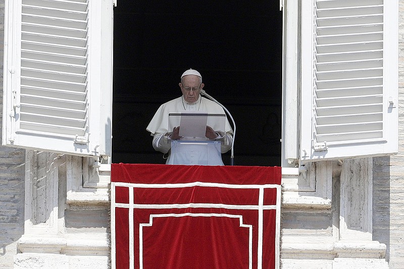 In this Sunday, Aug. 19, 2018 file photo, Pope Francis prays for the victims of the Kerala floods during the Angelus noon prayer in St.Peter's Square, at the Vatican. Pope Francis has issued a letter to Catholics around the world condemning the "crime" of priestly sexual abuse and cover-up and demanding accountability, in response to new revelations in the United States of decades of misconduct by the Catholic Church. (AP Photo/Gregorio Borgia, File)