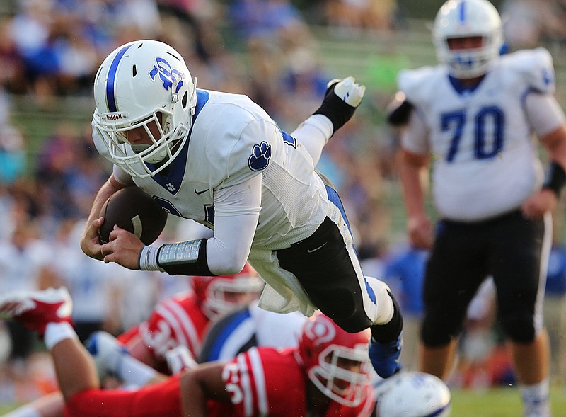 Staff photo by Erin O. Smith / 
Ringgold's Dalton Green (24) dives into the end zone for a touchdown during the Dalton vs. Ringgold football game Monday, August 20, 2018 at Harmon Field in Dalton, Georgia. The first half of the game was played Friday, but the second half was suspended until Monday.