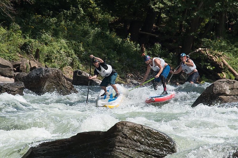 Stand-up paddleboarders navigate the rapids on the Ocoee River. (Photo contributed by Ocoee River Championships)