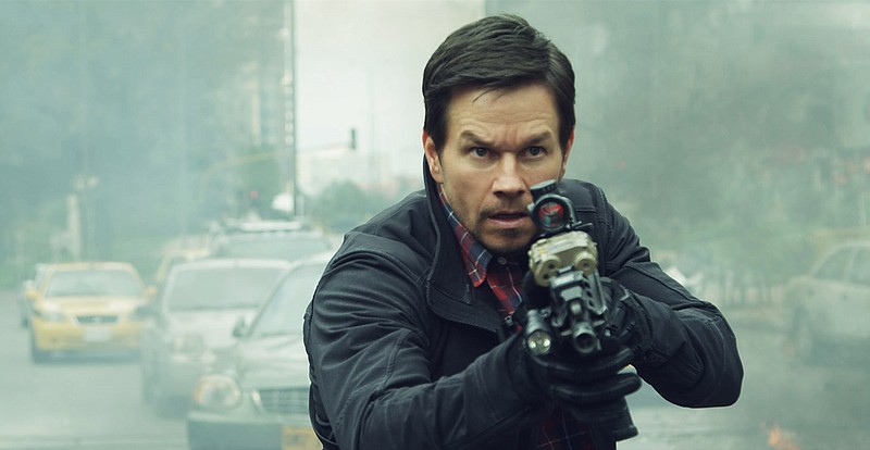 This cover image released by STXfilms shows Mark Wahlberg in a scene from "Mile 22." (STXfilms via AP)