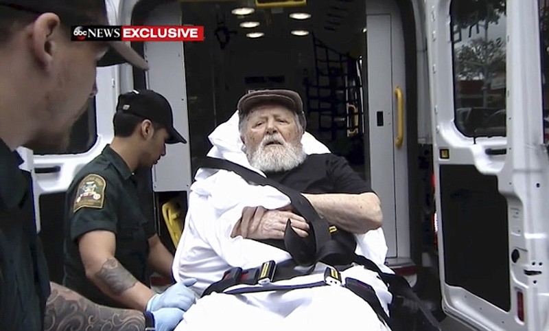 In this Monday, Aug. 20, 2018, frame from video, Jakiw Palij, a former Nazi concentration camp guard, is carried on a stretcher from his home into a waiting ambulance in the Queens borough of New York. Palij, the last Nazi war crimes suspect facing deportation from the U.S. was taken from his home and spirited early Tuesday morning to Germany, the White House said. (ABC via AP)