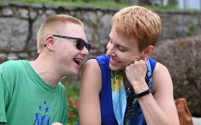 Luka Hyde, left, shares a moment with his mother, Deborah Rausch, in 2017.