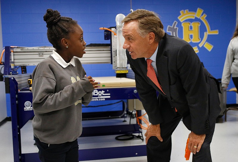 Staff photo by Doug Strickland / 
Gov. Bill Haslam, right, talks with Hixson Middle student Mariah Burse following a ribbon-cutting ceremony for 8 new Volkswagen eLabs at Hixson Middle School on Tuesday, Aug. 21, 2018, in Chattanooga, Tenn. The 8 new labs complete a total of 16 technology-centered labs in schools across Hamilton County.