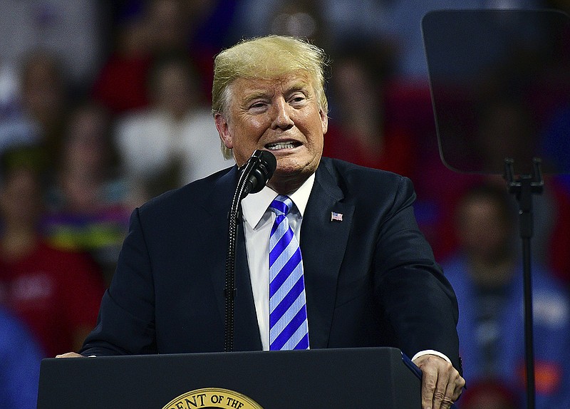 President Donald Trump speaks during a rally Tuesday, Aug. 21, 2018, at the Civic Center in Charleston W.Va. (AP Photo/Tyler Evert)