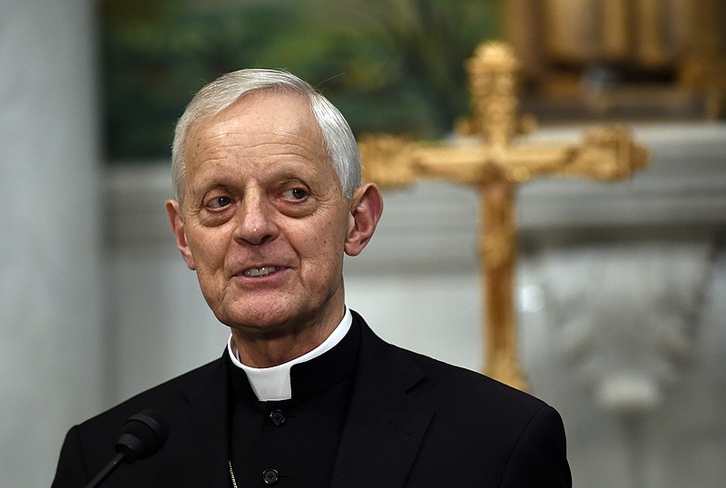 In this June 30, 2015, file photo Cardinal Donald Wuerl, archbishop of Washington, speaks during a news conference at the Cathedral of St. Matthew the Apostle in Washington. North Catholic High School, a Roman Catholic high school will shed the name of Wuerl, who was cited in a sweeping grand jury report as having allowed priests accused of sexual misconduct with children to be reassigned or reinstated while he was Pittsburgh's bishop. (AP Photo/Susan Walsh, File)