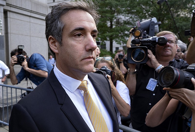 FILE - In this Aug. 21, 2018, file photo, Michael Cohen, former personal lawyer to President Donald Trump, leaves federal court after reaching a plea agreement in New York. Investigators in New York state issued a subpoena to Cohen as part of their probe into the Trump Foundation, an official with Democratic Gov. Andrew Cuomo's administration confirmed to The Associated Press on Wednesday, Aug. 22. (AP Photo/Craig Ruttle, File)