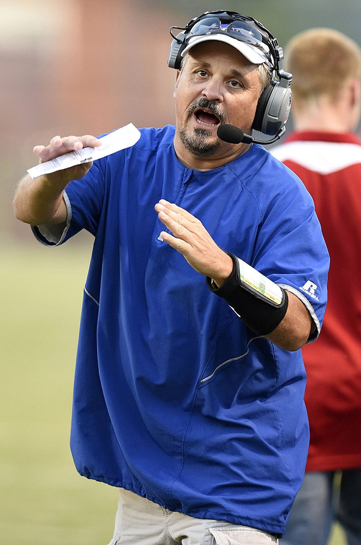 Derrick Davis calls a timeout during Polk County's home football game against East Ridge on Aug. 14, 2018. Davis stepped down as the Wildcats' head coach on Thursday after 19 seasons in charge of the program.
