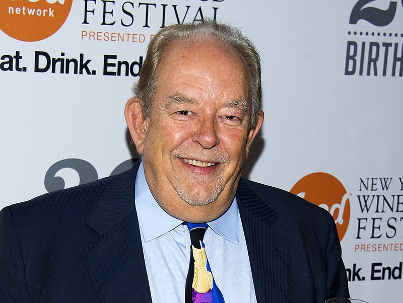 In this Oct. 17, 2013, file photo, Robin Leach attends the Food Network's 20th birthday party in New York. Leach, whose voice crystalized the opulent 1980s on TV's "Lifestyles of the Rich and Famous," has died, Friday, Aug. 24, 2018. (Photo by Charles Sykes/Invision/AP, File)