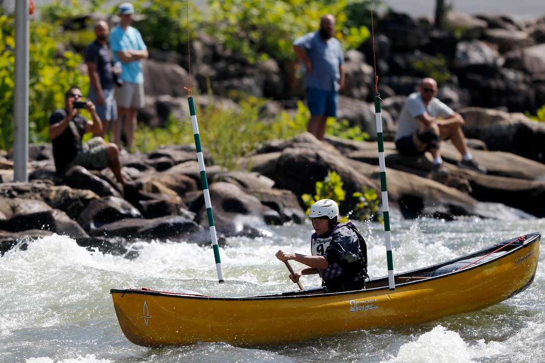 Staff photo by C.B. Schmelter /
Lucien Scott navigates a gate during the slalom event during the Ocoee River Championships on the 1996 Olympic Section of the Ocoee River on Friday, Aug. 24, 2018 in Copperhill, Tenn.