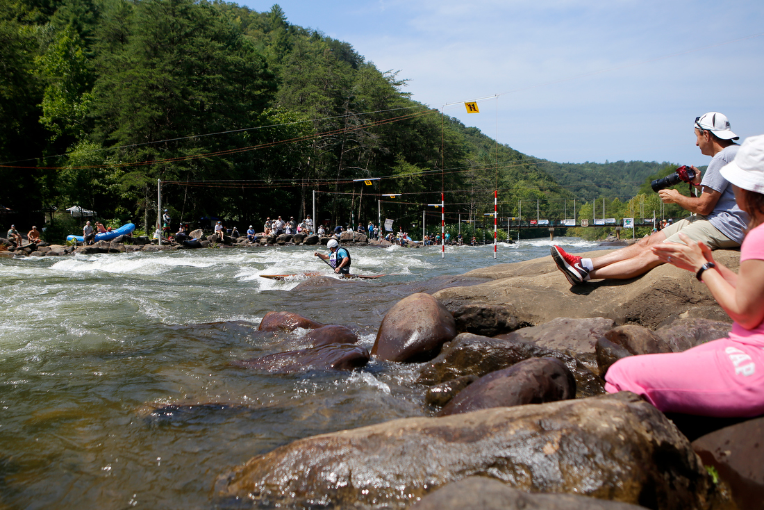 Staff photo by C.B. Schmelter /
People watch from the banks as Scott McCleskey competes in the slalom event during the Ocoee River Championships on the 1996 Olympic Section of the Ocoee River on Friday, Aug. 24, 2018 in Copperhill, Tenn.