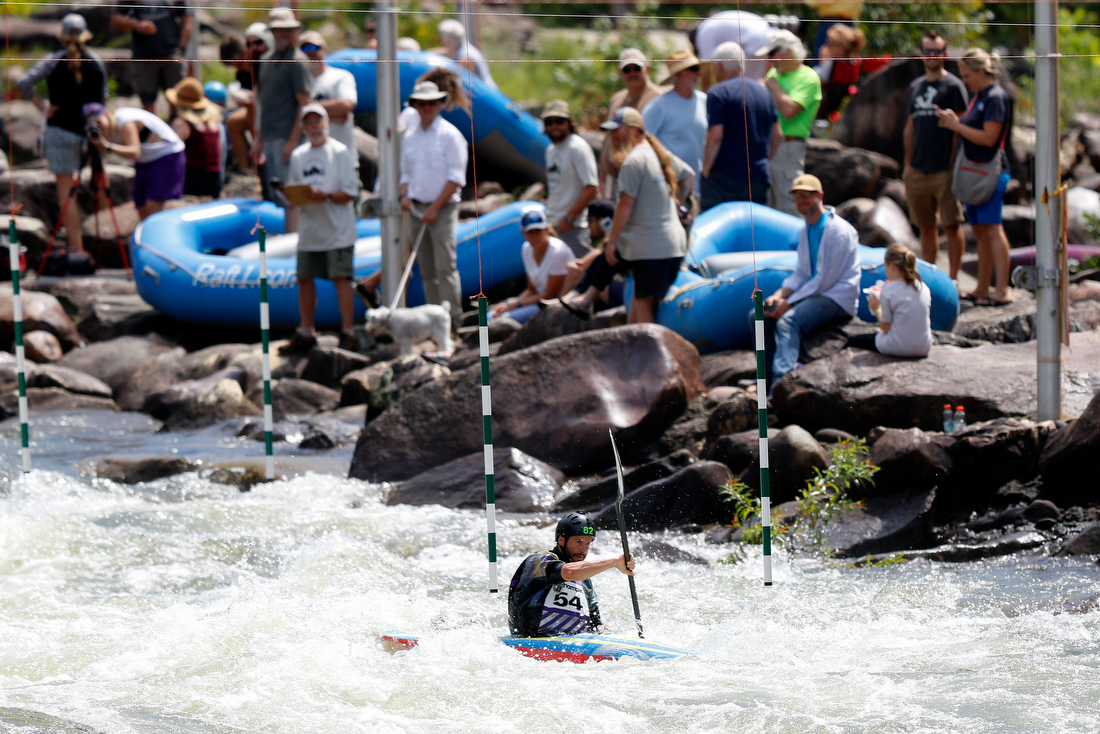 Staff photo by C.B. Schmelter /
Spectators watch as Greg Garrard competes in the slalom event during the Ocoee River Championships on the 1996 Olympic Section of the Ocoee River on Friday, Aug. 24, 2018 in Copperhill, Tenn.