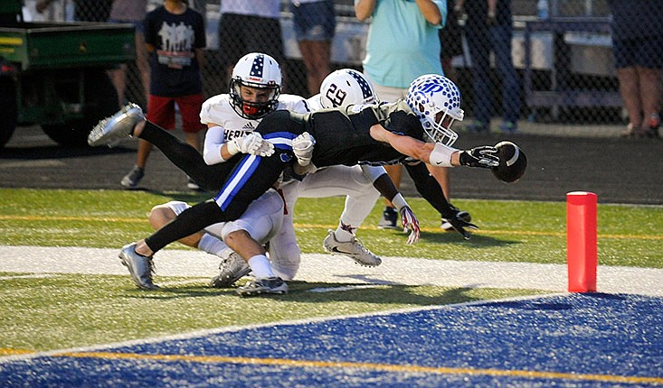 (Photo by Mark Gilliland) Ringgold's Kyle Wright reaches for the goal line for a touchdown during the game against Heritage that took place on August 24, 2018.