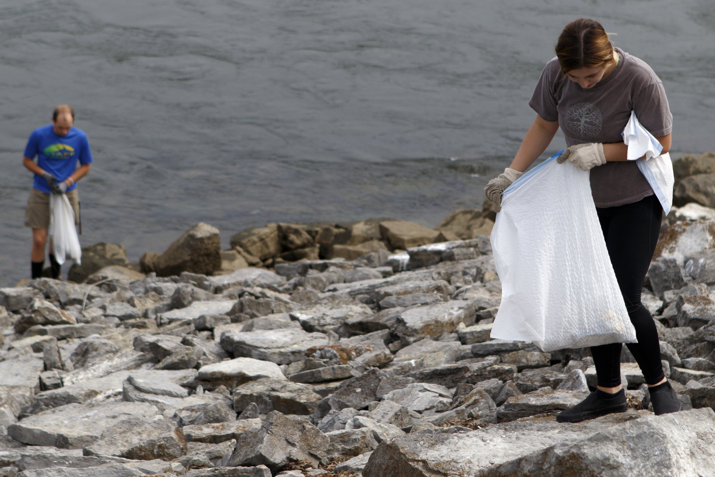 Volunteers take to the Tennessee Riverwalk at the Chickamauga Dam as part of a cleanup effort organized by GreenSteps and The Wilderness Society.