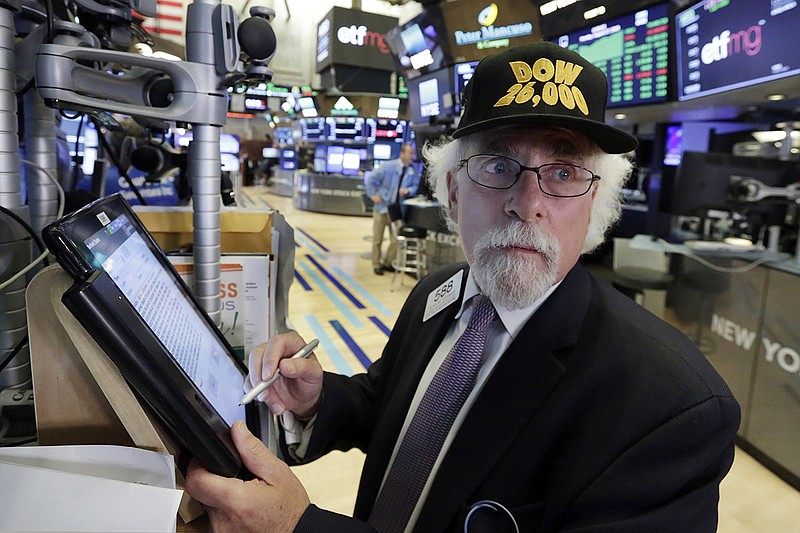 Trader Peter Tuchman wears a "Dow 26,000" hat as he works on the floor of the New York Stock Exchange, Monday, Aug. 27, 2018. The Dow Jones Industrial Average jumped 208 points, or 0.8 percent, to 26,002. (AP Photo/Richard Drew)