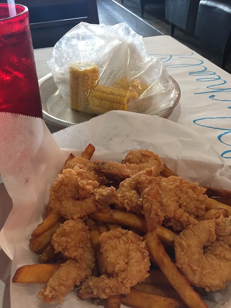 
The Fried Shrimp Basket includes a mound of Cajun fries topped with eight shrimp. Three pieces of corn on the cob are an additional $2.50. / Photo by Susan Pierce
