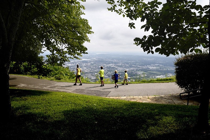 Staff photo by Robin Rudd /
With the city of Chattanooga below visitors walk on one of the many trails at the Point Park unit of the Chickamauga and Chattanooga National Military Park on August 19, 2018.