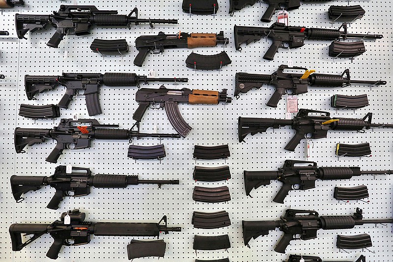 In this July 20, 2014, file photo, guns are displayed for sale by an arms seller east of Colorado Springs, Colo. The U.S. is among wealthy countries where suicides by gun outnumber gun killings, according to a study of 1990-2016 data, released on Tuesday, Aug. 28, 2018. (AP Photo/Brennan Linsley, File)