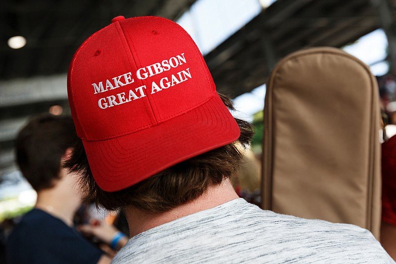 Adam Baird from Anniston, Ala., wears a "Make Gibson Great Again" hat as he waits in line at auditions for American Idol at the First Tennessee Pavilion on Tuesday, Aug. 28, 2018, in Chattanooga, Tenn. Thousands of contestants from across the region turned out to audition for the long-running talent show.
