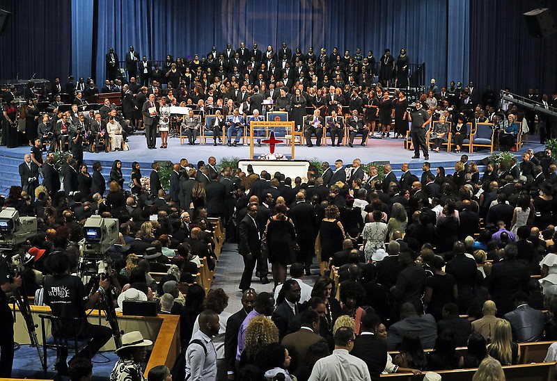 Family and guests arrive at the start of the funeral service for Aretha Franklin at Greater Grace Temple, Friday, Aug. 31, 2018, in Detroit. Franklin died Aug. 16, 2018, of pancreatic cancer at the age of 76. (AP Photo/Paul Sancya)