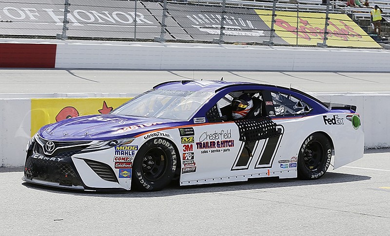 Denny Hamlin drives down pit road at Darlington Raceway on Saturday after earning the pole position in qualifying for Sunday's Southern 500. Hamlin is hoping for a win to assure himself of a spot in the NASCAR Cup Series playoffs.